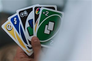 Player's hand holding Uno cards
